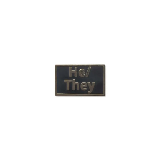 Black He/Him lapel pin featuring embossed metallic text, offering a sleek, professional design for subtle pronoun visibility and gender identity expression.