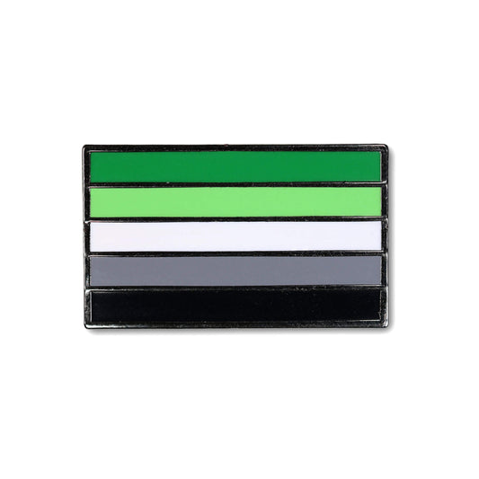 Flag-shaped pin with green, white, gray, and black stripes on a white background