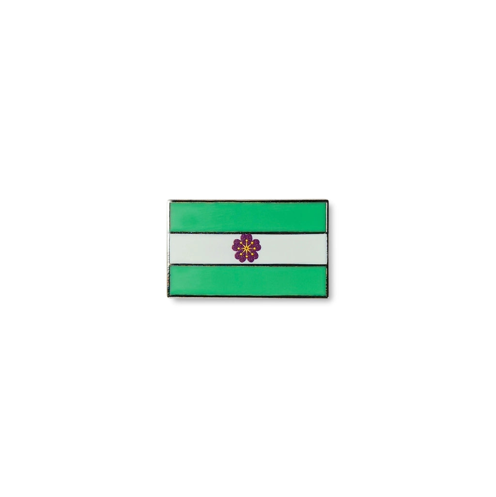 Rectangular Diamoric lapel pin featuring three horizontal stripes green, white, and green with a small purple flower at the centre.