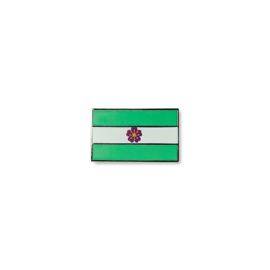 Rectangular Diamoric lapel pin featuring three horizontal stripes green, white, and green with a small purple flower at the centre.
