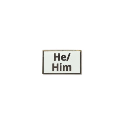 Rectangular He/Him lapel pin with a clean white enamel background and bold black lettering, framed with a thin metallic border a clear and simple pronoun badge ideal for everyday wear.