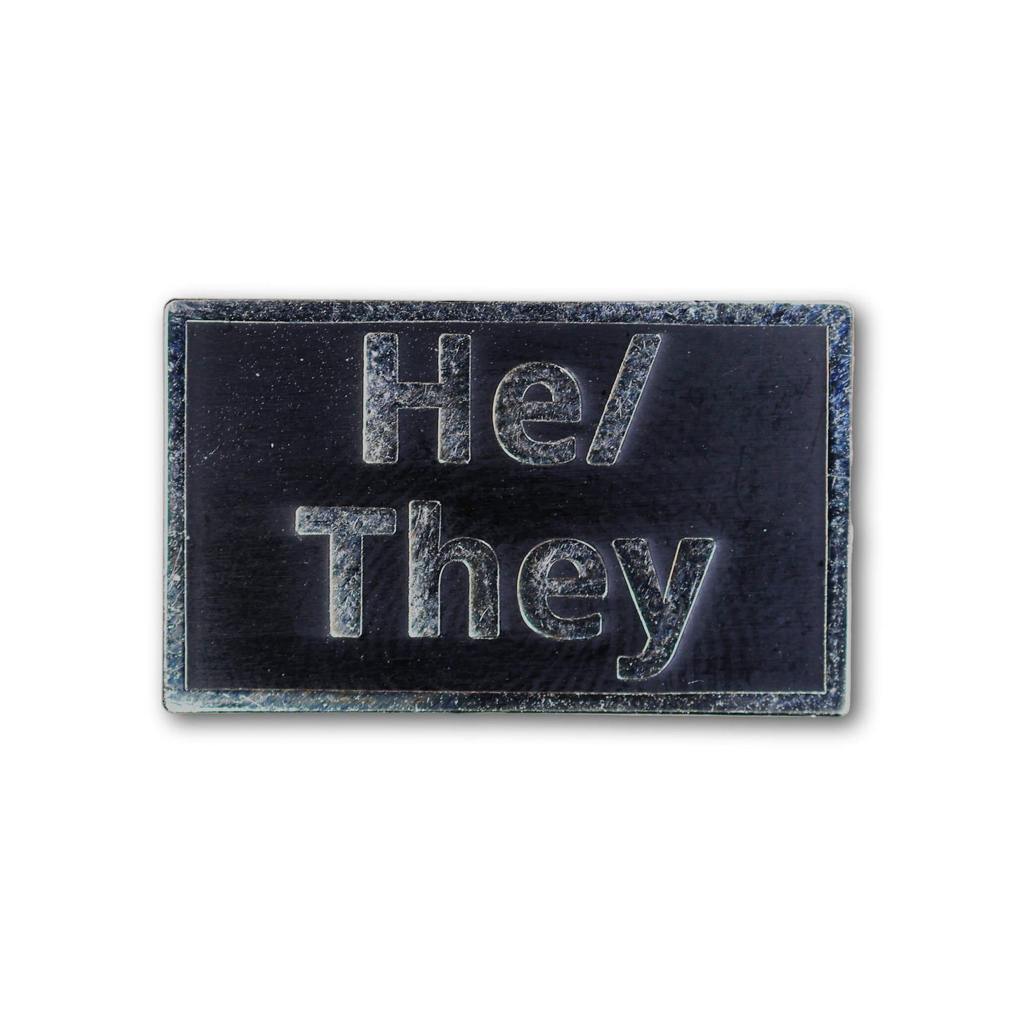 Rectangular patch with 'He/They' text on a black background