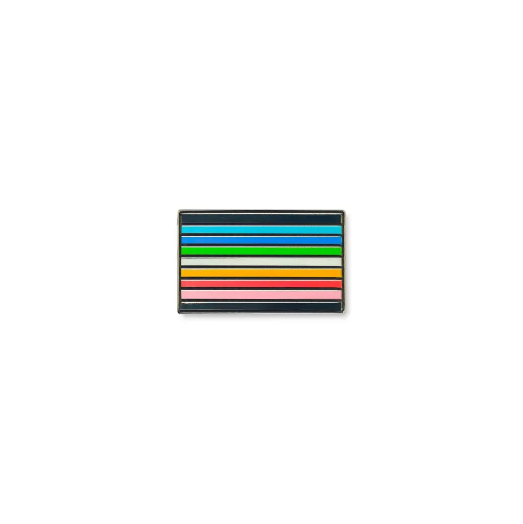 Queer lapel pin featuring horizontal rainbow-toned stripes in blue, green, yellow, orange, red, and pink with black borders.