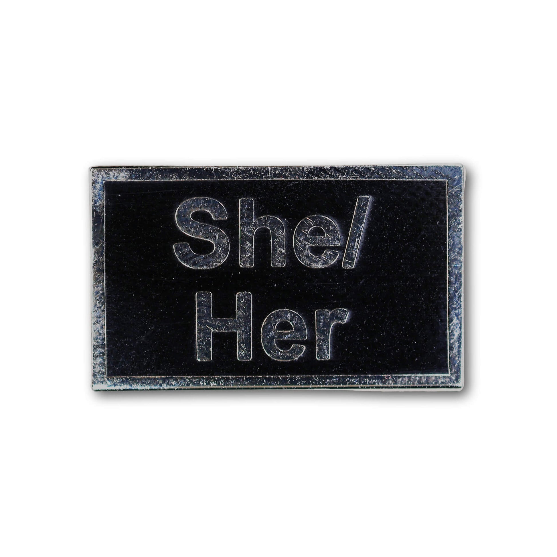 Rectangular patch with 'She/Her' text on a black background