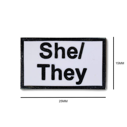 Rectangular patch with 'She/They' text on a white background